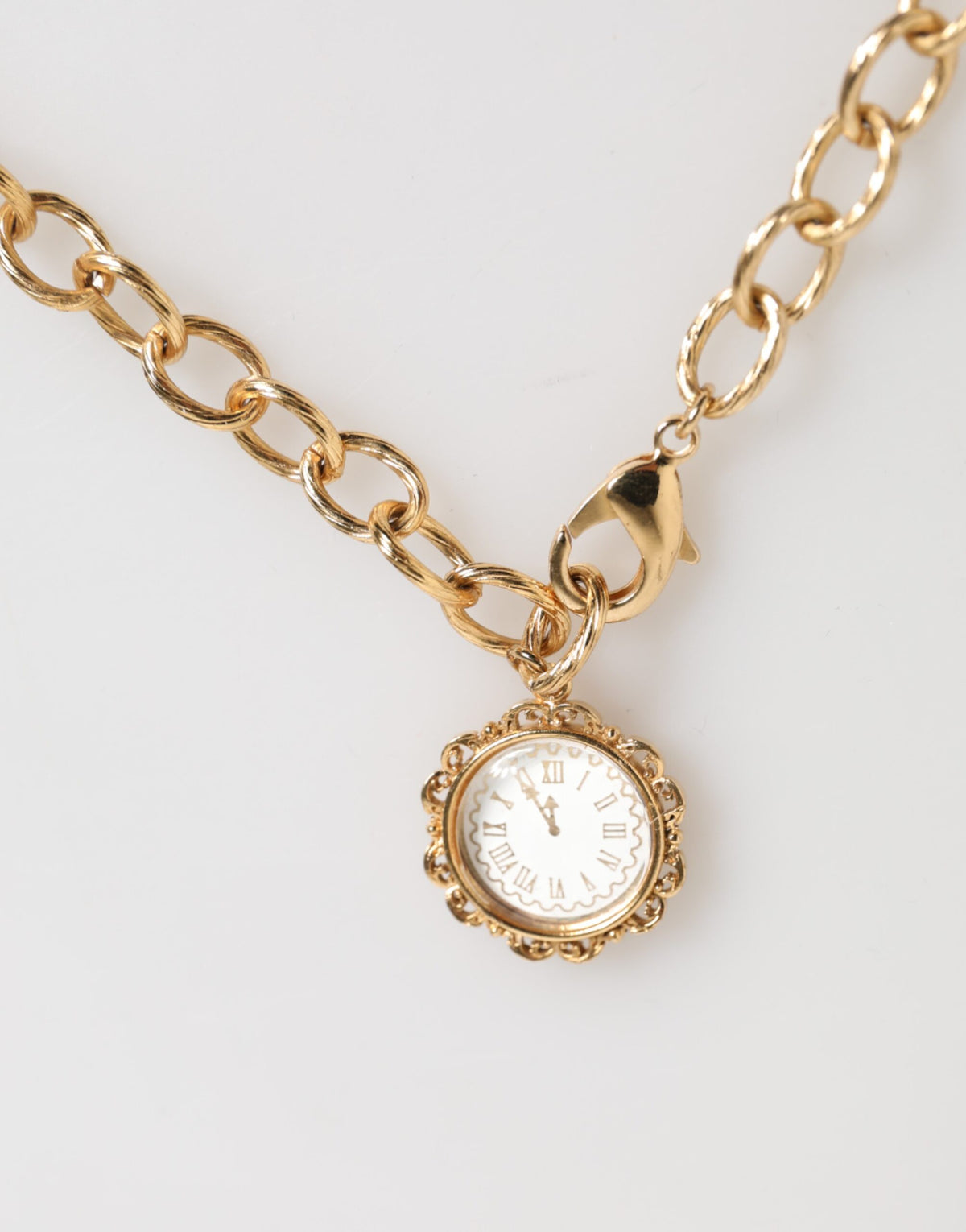 Collier Dolce & Gabbana à pendentifs horloge et cristaux en laiton doré – SMY11342